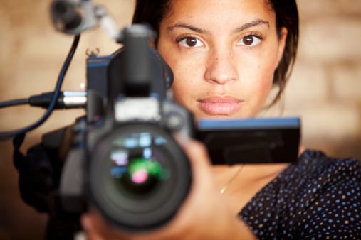 Woman directing camera at you